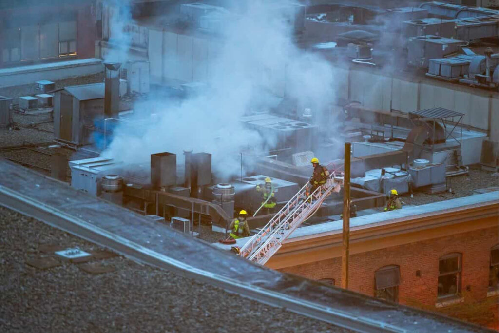 Fire crews on top of 1118 Homer Street.
