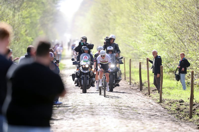 Tadej Pogacar rides with his team over the cobblestones of the 'trench' of Aremberg in Wallers, northern France. Photograph: Francois Lo Presti/AFP via Getty Images
