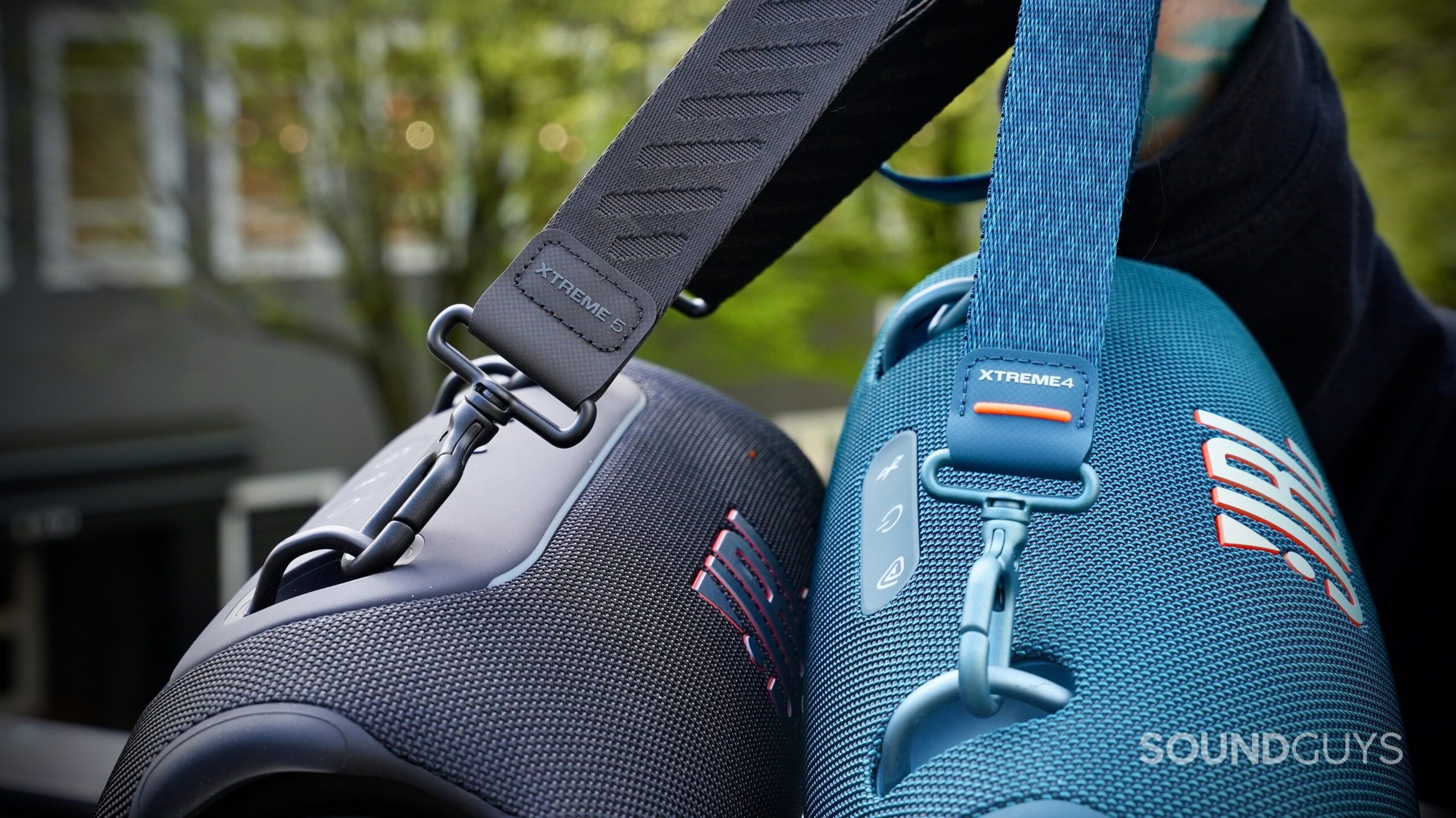 JBL Xtreme 5 vs Xtreme 4 - 5 Close-up of the carrying straps on the JBL Xtreme 5 and JBL Xtreme 4 showing attachment points and branding.