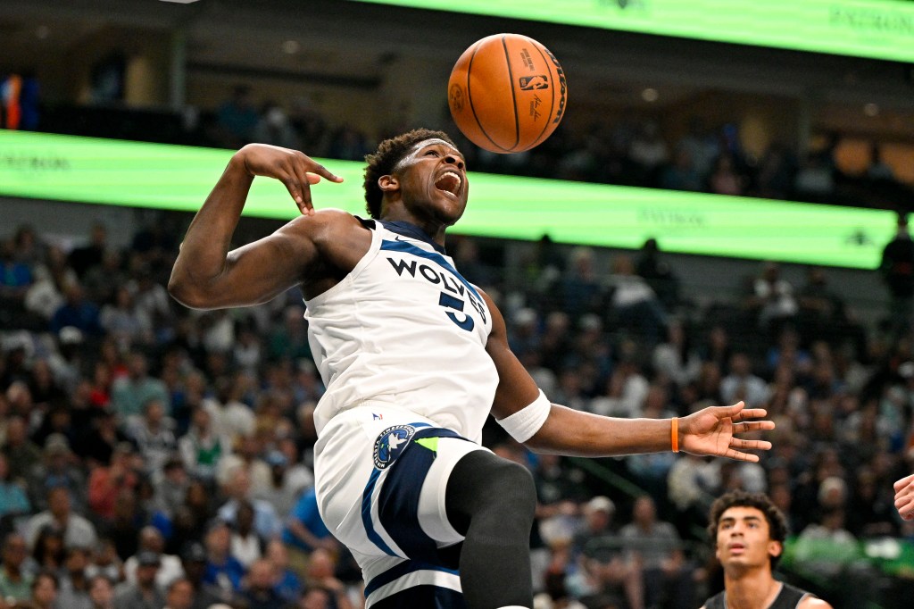 Minnesota Timberwolves guard Anthony Edwards (5) dunks the ball against the Dallas Mavericks during the second quarter at the American Airlines Center.