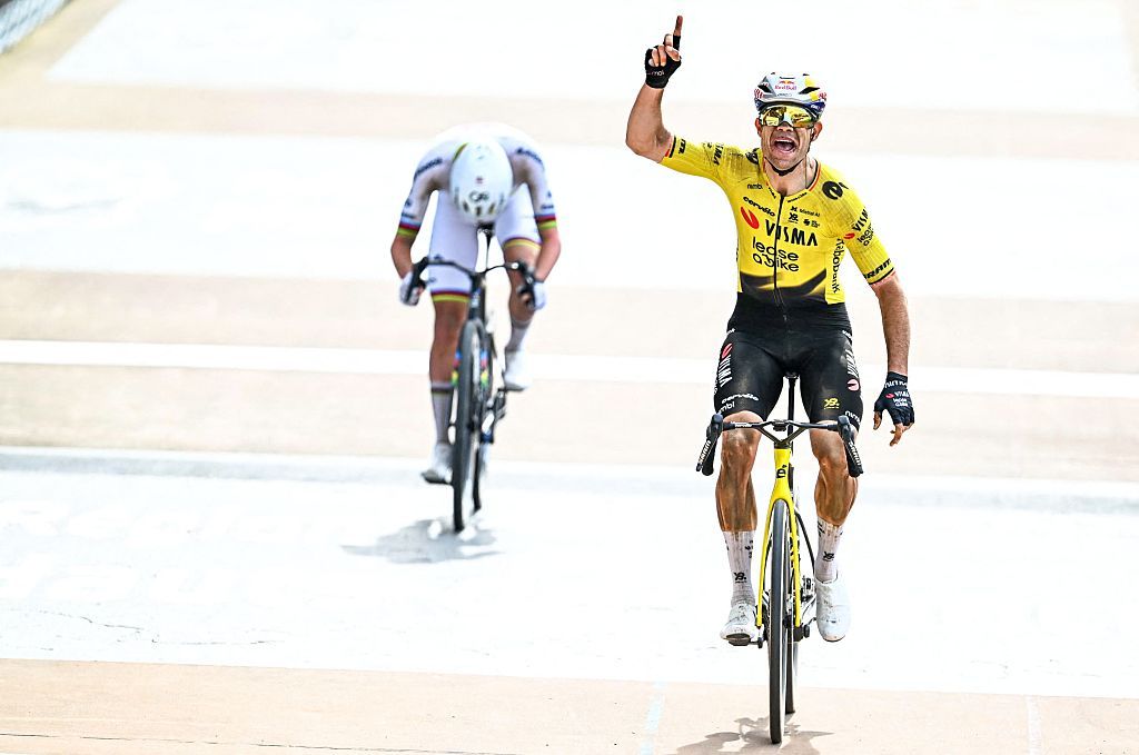 Belgian Wout van Aert of Team Visma-Lease a Bike celebrates as he crosses the finish line to win the men's Paris-Roubaix