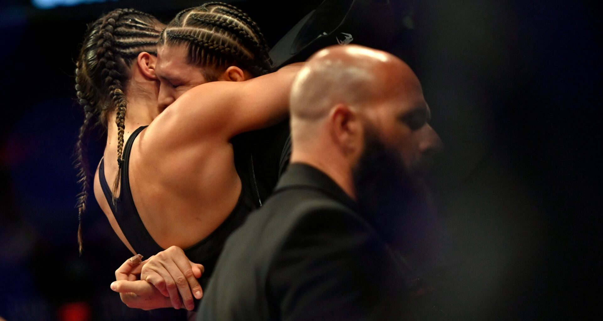 Tracy Cortez and Brian Ortega embrace at UFC 274