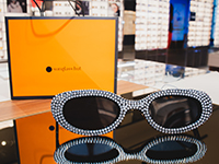 Sunglass Hut shopping bag and glasses