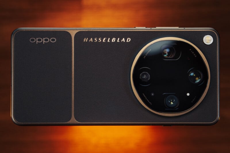 A close-up of the back of an Oppo smartphone featuring a large circular Hasselblad-branded camera module with multiple lenses, set against a warm, glowing background.