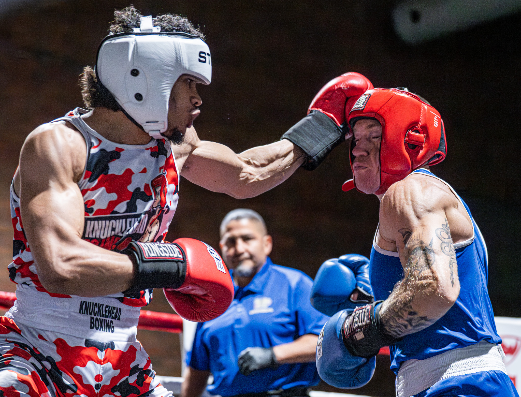 Sir Robert Ellenberg (white) lands a left-handed punch against Sean...