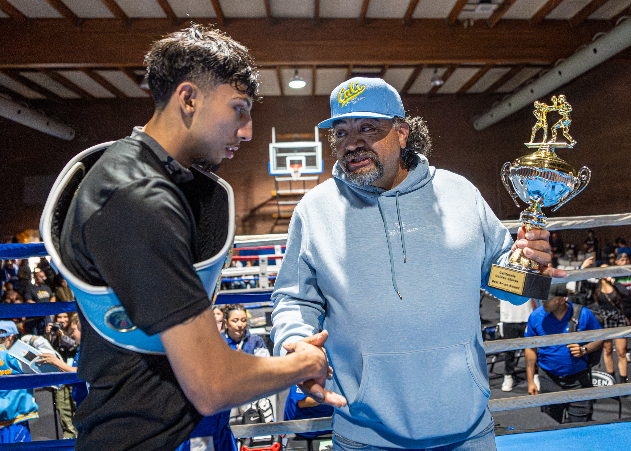 Fausto De La Torre congratulates Steven Sierra for winning the...