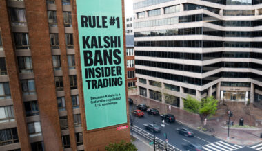 FILE - An advertisement for prediction market platform Kalshi hangs at 13th and L Streets in northw...