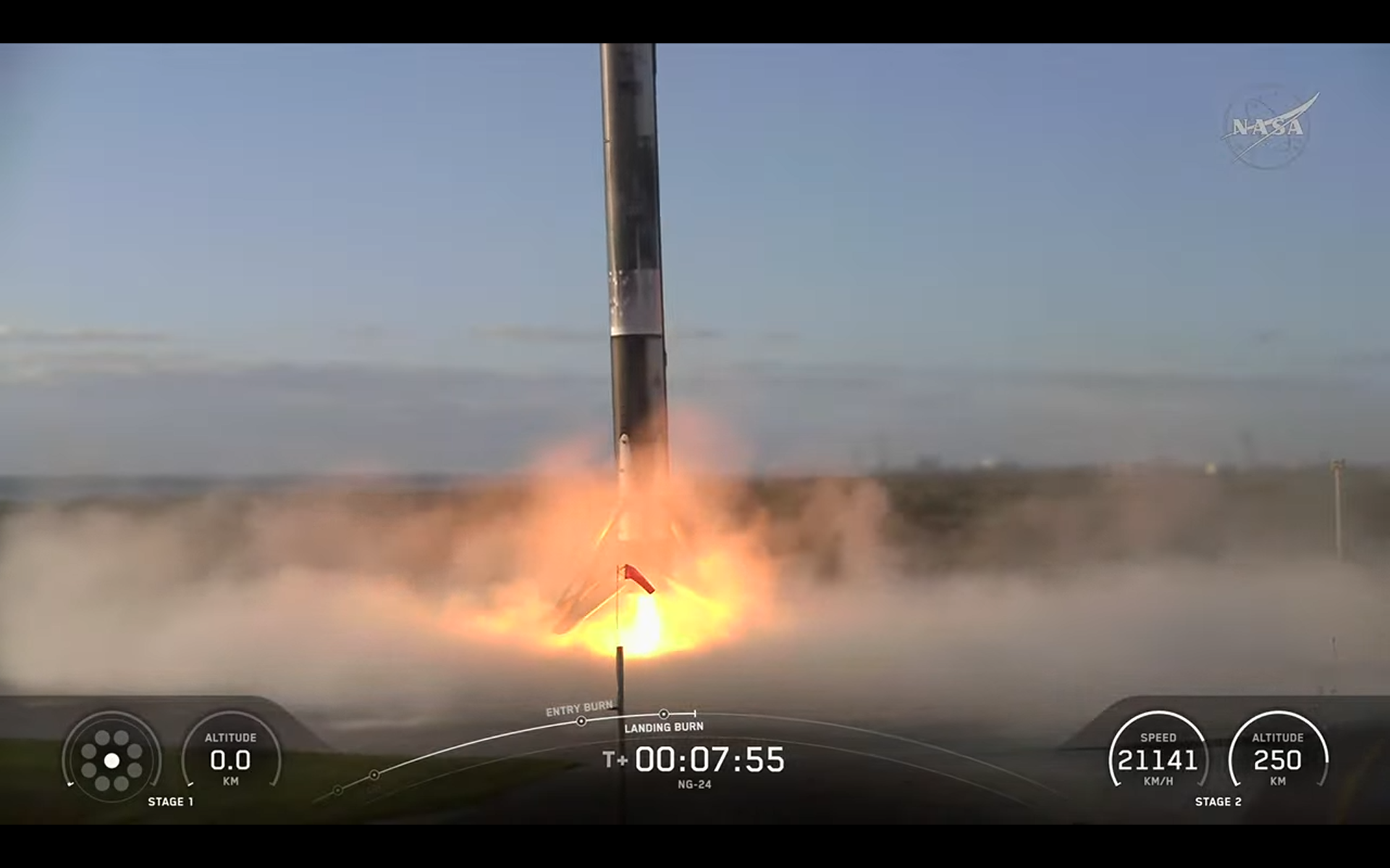 A sooty black and white SpaceX rocket lands back on Earth after launching NG-24.