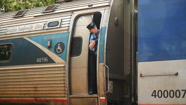 An Amtrak employee pokes her head out of one of the cabins as the Rockingham Special approaches its stop near gate E for race day at Rockingham Speedway on Saturday, April, 4, 2026. 