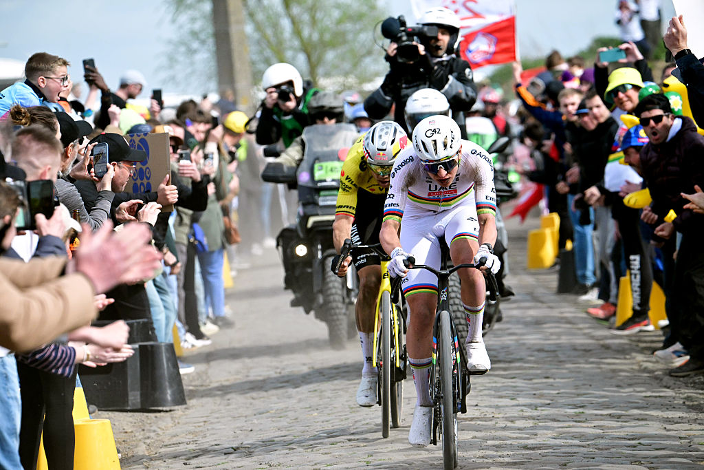 Wout van Aert of Belgium and Team Visma | Lease a Bike and Tadej Pogacar of Slovenia and UAE Team Emirates - XRG compete in the breakaway passing through the Carrefour de l'Arbre
