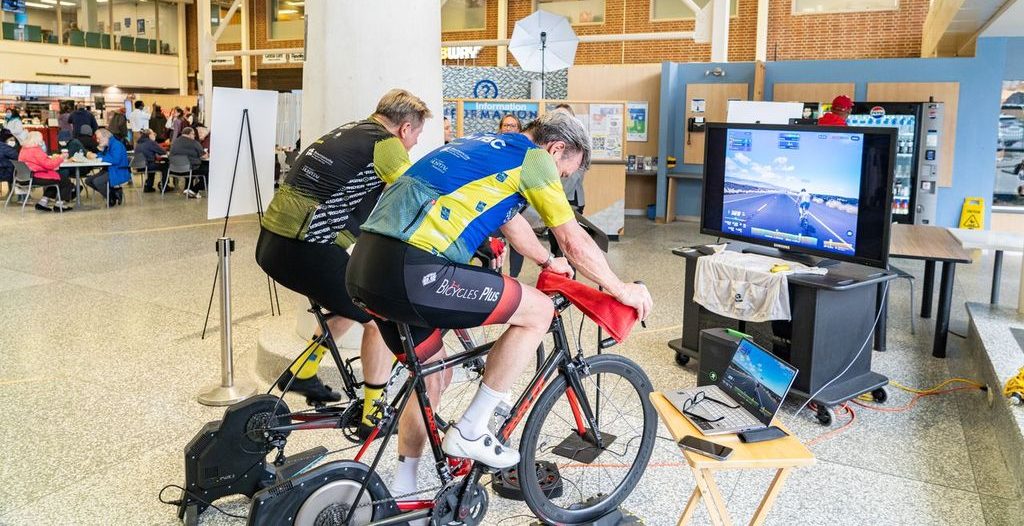 Brian Bussiere and a fellow cyclist at an indoor cycling event at Lakeridge Health Oshawa to drum up support for the Ride for the 'Ridge event in May