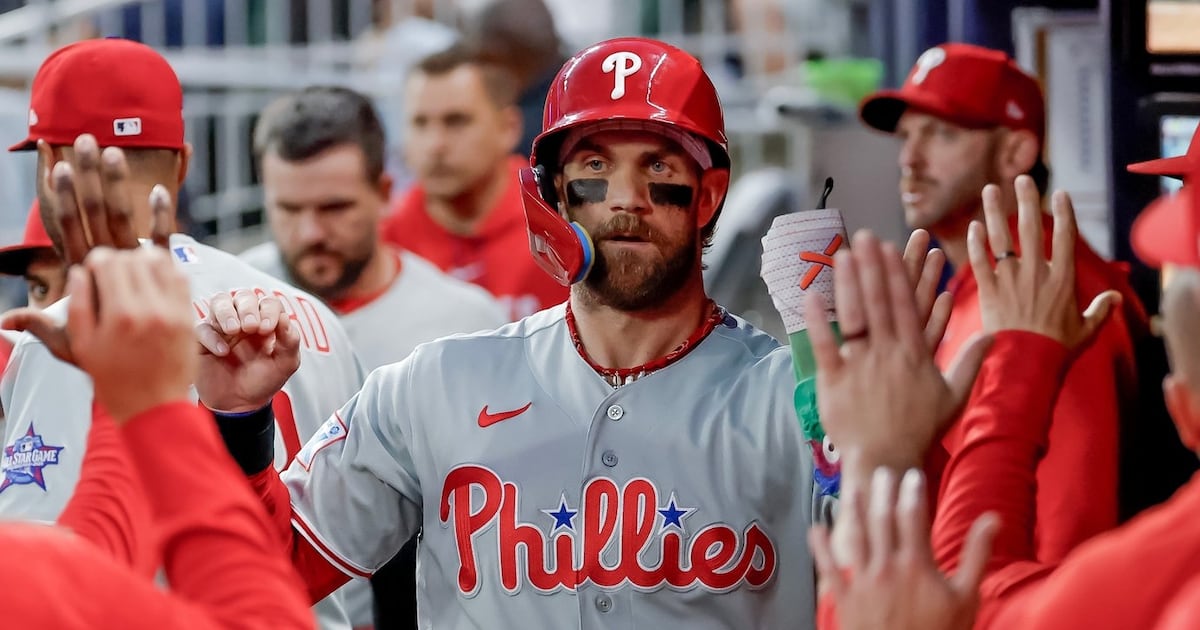 Bryce Harper leads Phillies past Braves in 10 innings to stop 10-game losing streak