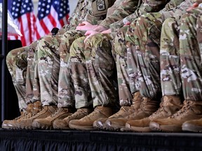 Soldiers in the U.S. Army National Guard listen as President Donald Trump speaks during a Memphis Safe Task Force roundtable on March 23, 2026 in Memphis.