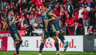 Iloski celebrates his goal with Damiani and Lukic
