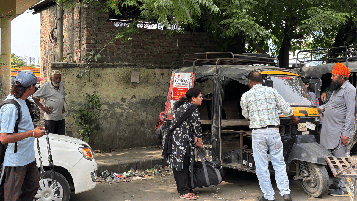 Ads promising visa can be seen on an auto rickshaw on the road | Samridhi Tewari | ThePrint
