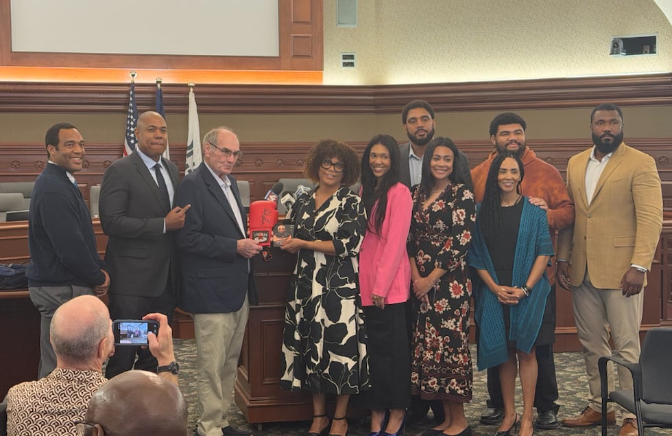 George Foreman's family with Sioux City Mayor Bob Scott. The family was in Sioux City on April...