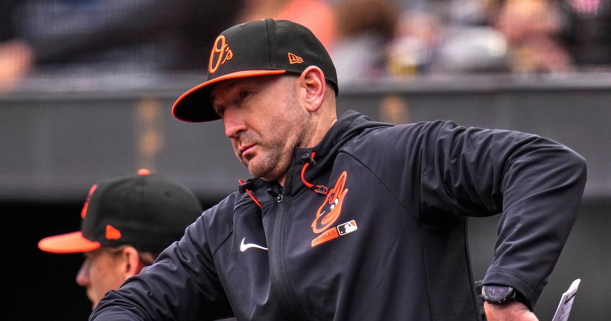 Baltimore Orioles manager Craig Albernaz OK after taking line drive to face