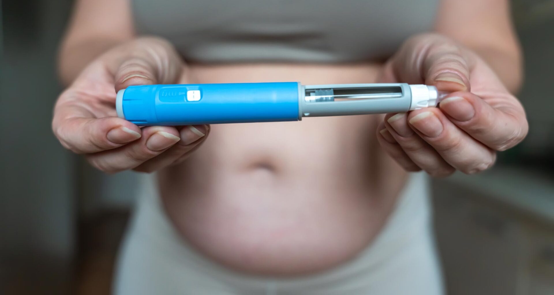 Woman Holding GLP-1 Injection Pen Ozempic