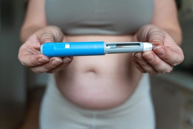 Woman Holding GLP-1 Injection Pen Ozempic