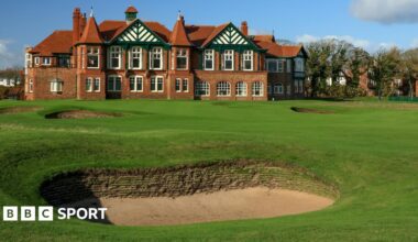A view of a bunker in front of the 18th green at Royal Lytham & St Annes, with the clubhouse in the background