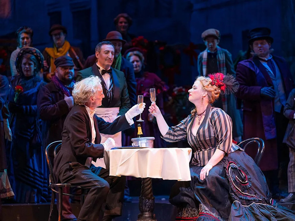  Thomas Goerz as Alcindoro and Lara Ciekiewicz as Musetta in Vancouver Opera’s 2026 production of La Bohème.