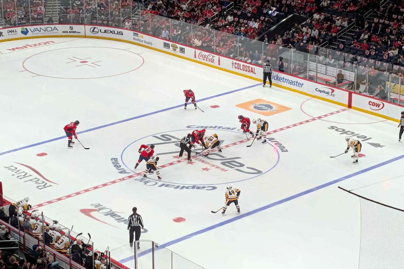 Alex Ovechkin takes a faceoff against Sidney Crosby