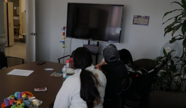 Andrea, Miguel and their baby are seen at the offices of the Welcome Collective in Montreal in late April.