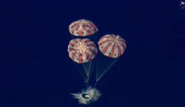 The Artemis II Orion capsule splashes down in the Pacific Ocean.