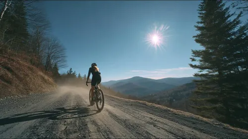 Artistic impression of Moriah Wilson biking on a gravel road in Vermont
