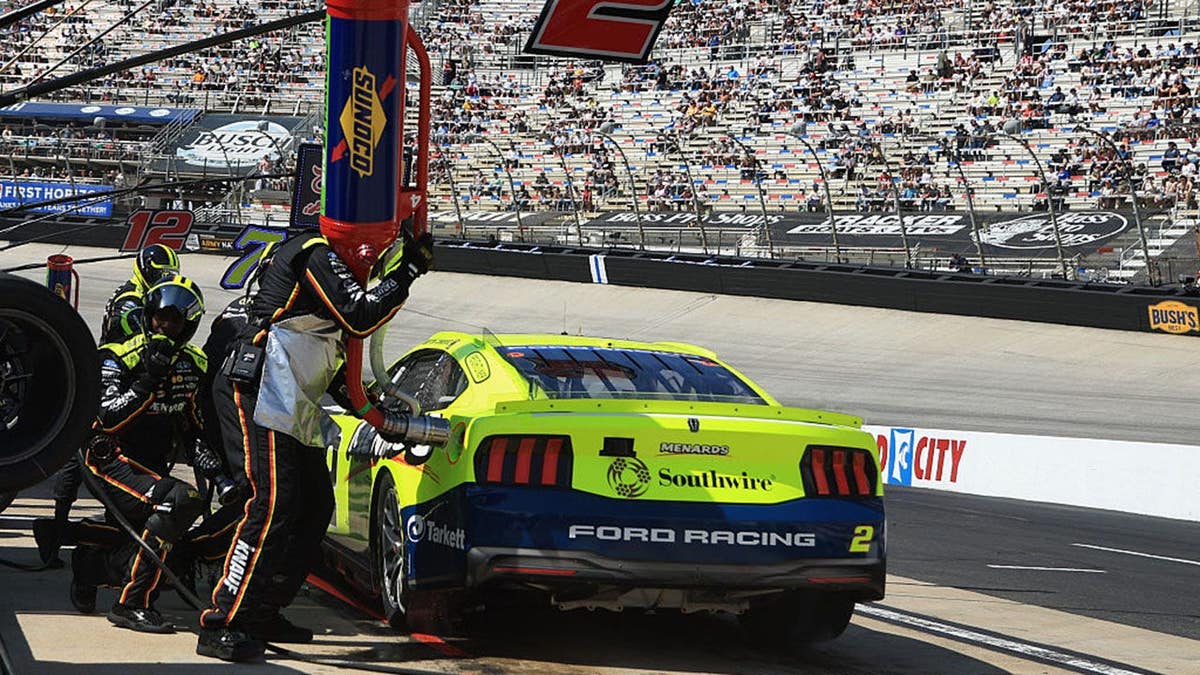Austin Cindric's pit crew servicing his race car at Bristol Motor Speedway