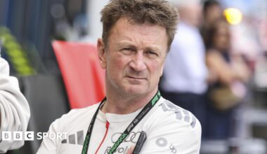 Allan McNish wearing an Audi-branded shirt