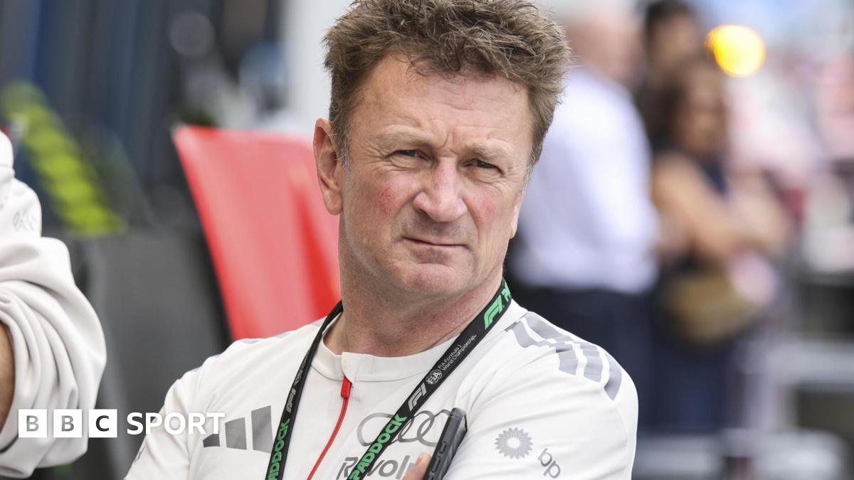 Allan McNish wearing an Audi-branded shirt