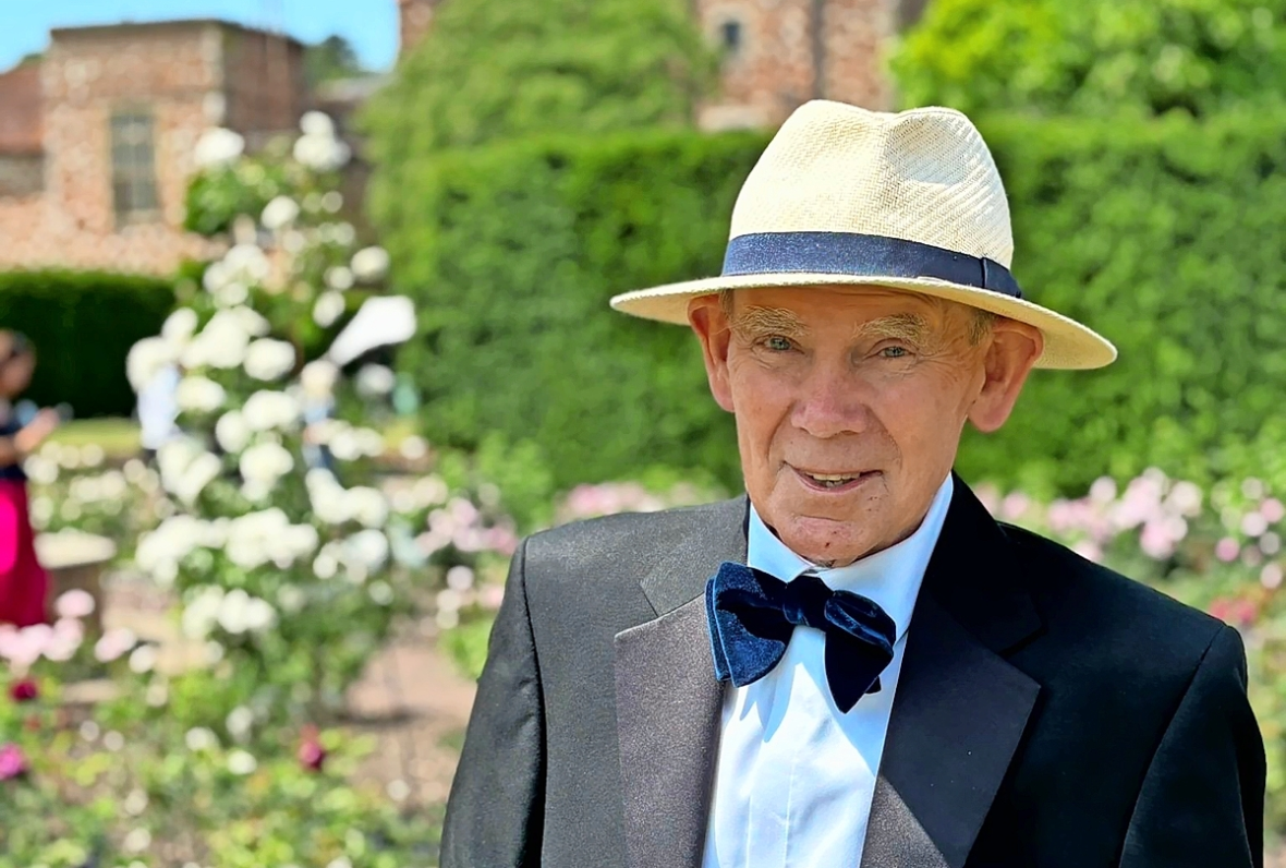 Paddy in a tuxedo and straw hat at Glyndebourne.