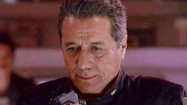 Captain Bill Adama (Edward James Olmos) uses the intercom in Battlestar Galactica