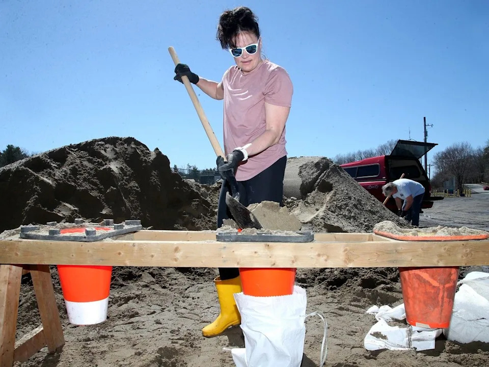  Bethany MacNeill was filling sandbags in Constance Bay on Friday. She said she had flooding in 2017, 2019 and 2013, with up to 3,000 bags used around her home during those floods.