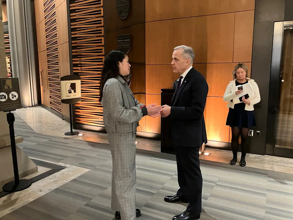 Manitoba Immigration Minister Malaya Marcelino shakes hands with Prime Minister Mark Carney on a February 2026 trip to Ottawa to discuss immigration.