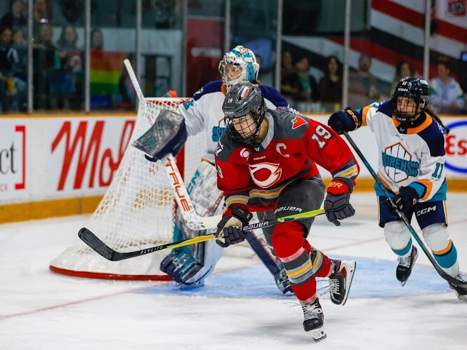  Charge captain Brianne Jenner crosses in front of Sirens goaltender Kayle Osborne in pursuit of the puck in PWHL action at TD Place in Ottawa on Saturday.