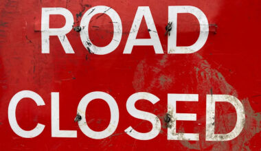 Road closure after multi-vehicle oil spill crash