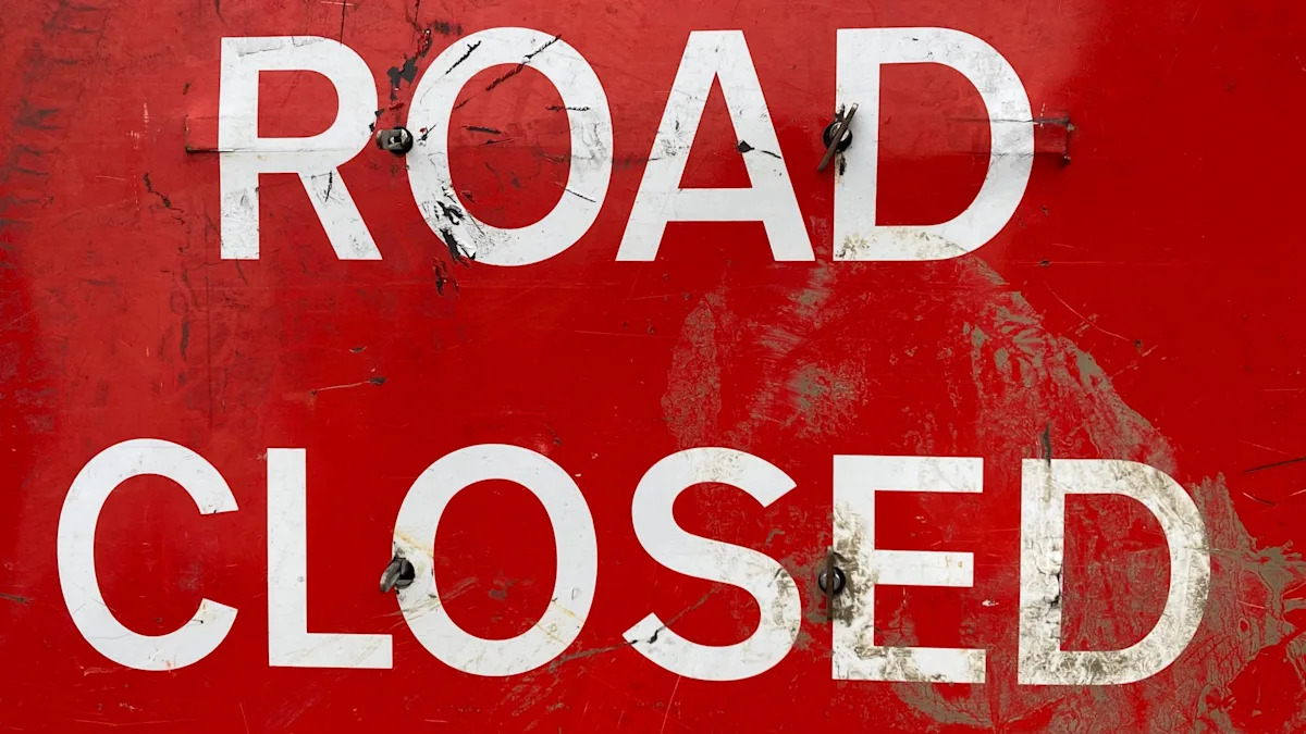 Road closure after multi-vehicle oil spill crash