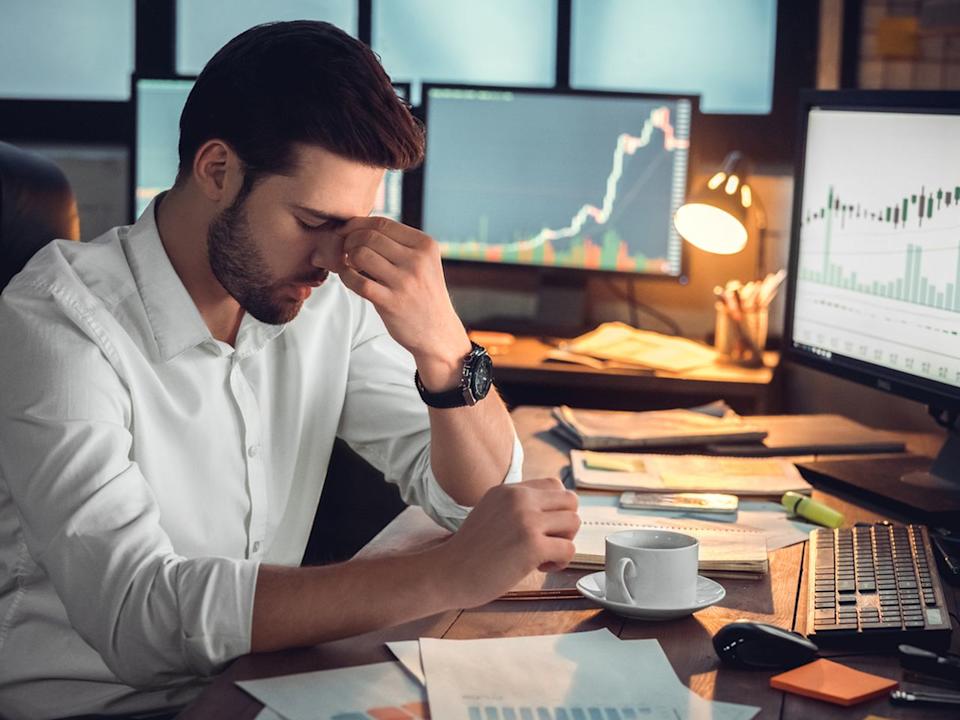 Depressed frustrated trader tired of overwork or stressed by bankruptcy