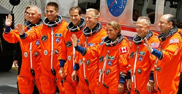 On July 15, 2009, Julie Payette, third from right, and other astronauts for STS-127 pose hours before Shuttle Endeavour launched from the Kennedy Space Center in Cape Canaveral, Fla.