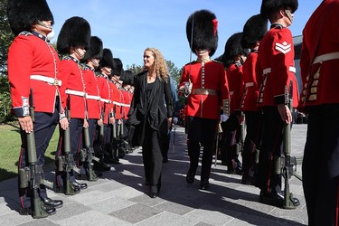 Newly sworn-in Governor General Julie Payette inspects the honour guard at Rideau Hall in Ottawa on Oct. 2, 2017.