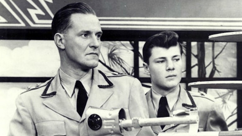 Captain Video (Al Hodge) and Video Ranger (Don Hastings) fire a gun in Captain Video and His Video Rangers