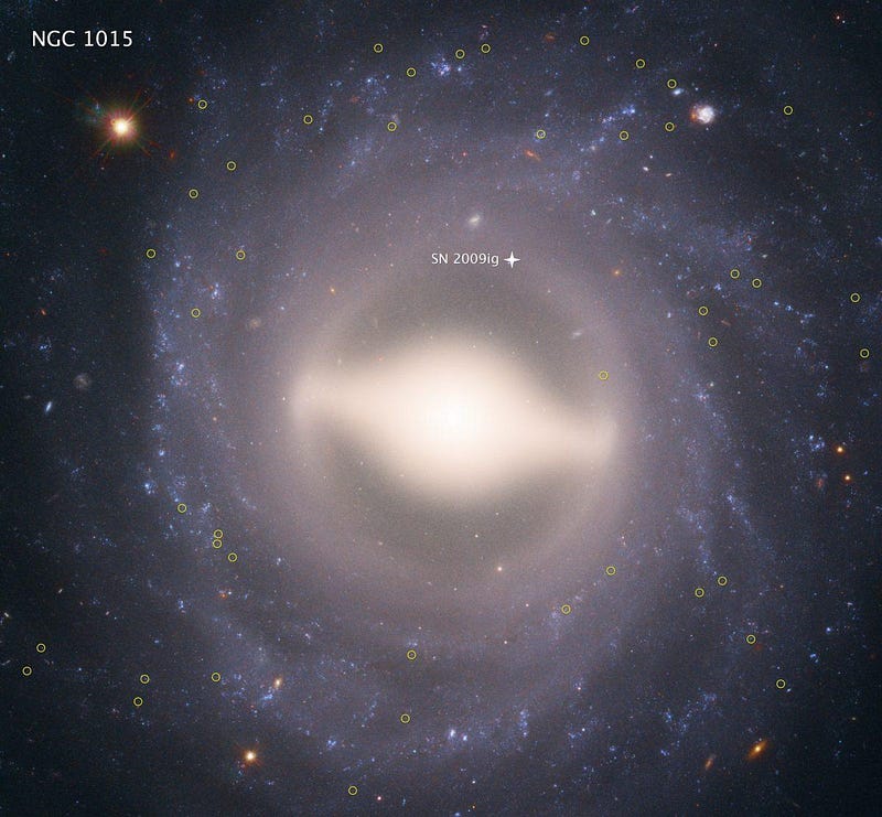 An image of the spiral galaxy NGC 1015 with a bright central core and the location of supernova SN 2009ig marked with a white arrow. Various stars and celestial objects surround the galaxy, adding context to ongoing Hubble tension discussions fueled by new measurements.