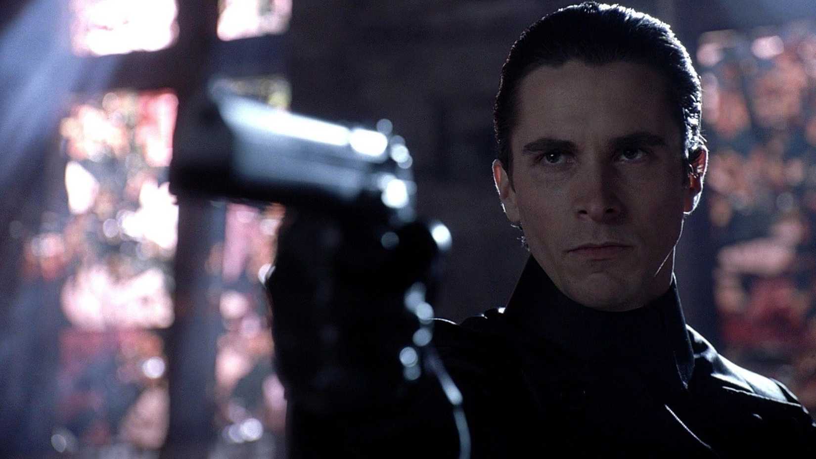 Christian Bale as John Preston pointing a gun in Equilibrium