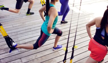 people in workout clothes stretching