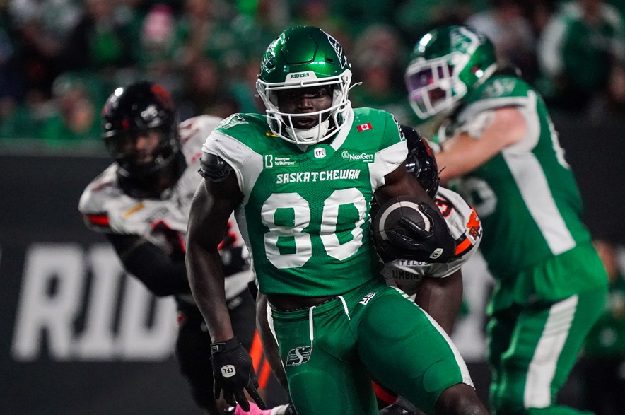 Saskatchewan Roughriders receiver Ajou Ajou (80) runs the football against the B.C. Lions during the first half of CFL football action in Regina, on Saturday, October 25, 2025.