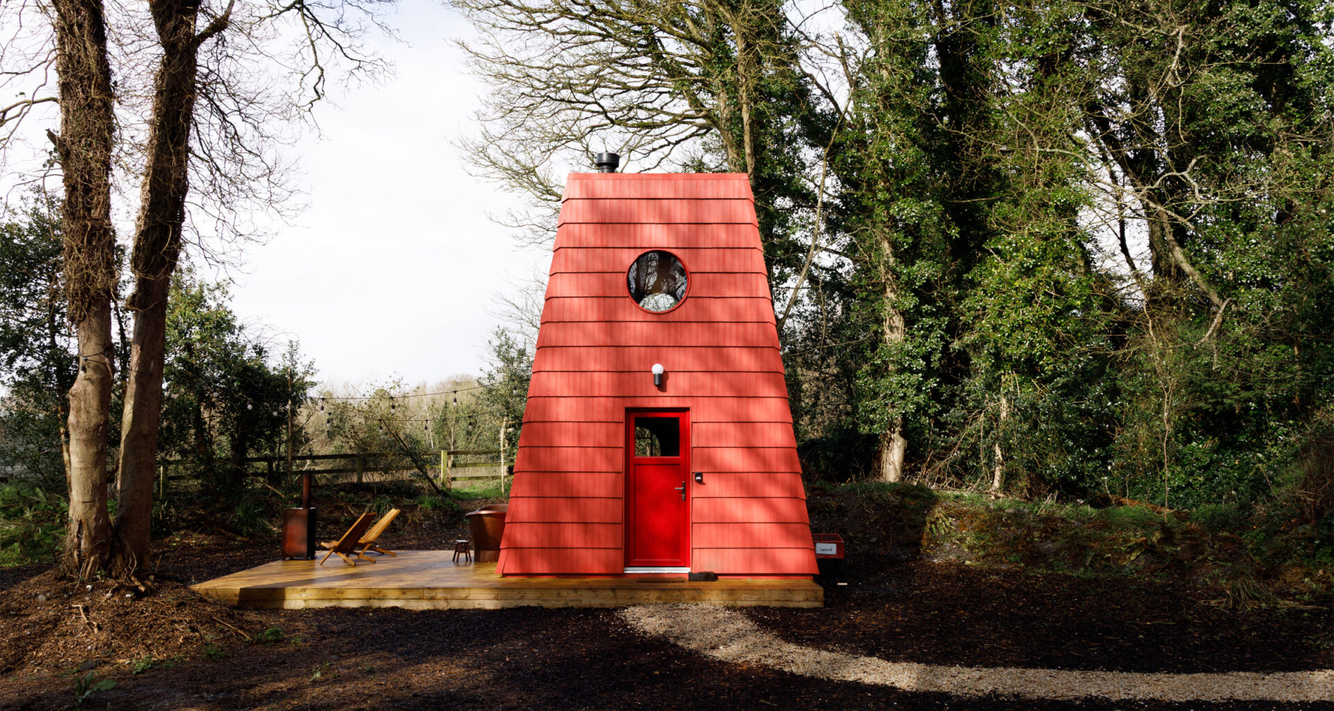 Studio Bucky cloaks Cucu cabin in Ireland with red shingles