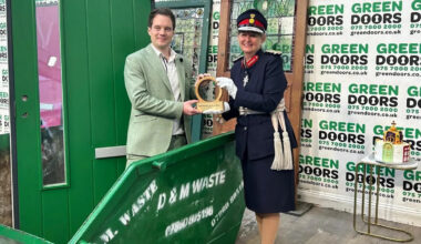 Man receives King's Award from inside a skip