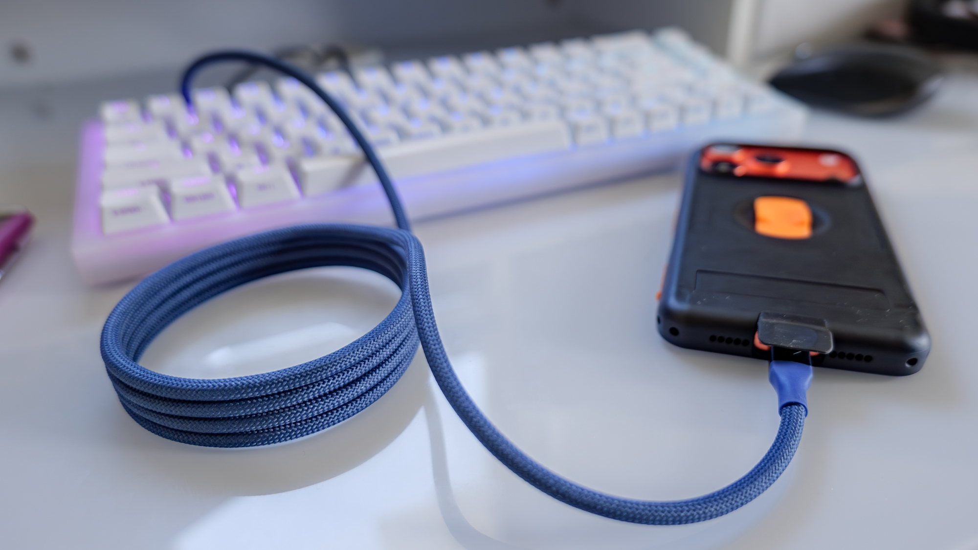Scosche Statik MagStack USB-C cable charging an iPhone.